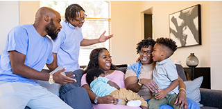 Image of extended family sitting and talking about CGD