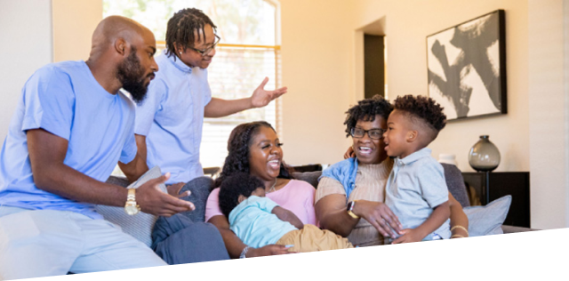 Image of extended family sitting and talking about CGD