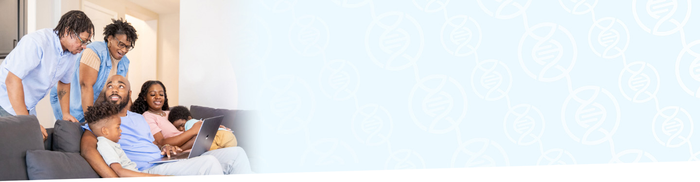 Image of an immediate family gathering with their extended family members looking at a laptop computer